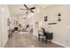Spacious living area featuring high ceilings, a fireplace, abundant natural light, and hardwood flooring at 15021 N 19Th Way, Phoenix, AZ 85022