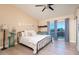 Bright main bedroom with a ceiling fan and sliding glass doors to the back yard at 15021 N 19Th Way, Phoenix, AZ 85022