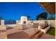 Outdoor patio with outdoor fireplace, brick flooring and patio furniture under the sky, ideal for relaxation and outdoor gatherings at 15021 N 19Th Way, Phoenix, AZ 85022