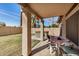 Covered patio area in the backyard with outdoor seating and a hot tub at 1569 E Princeton Ave, Gilbert, AZ 85234