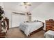 Comfortable bedroom with neutral carpet, ceiling fan, and ensuite bathroom at 1569 E Princeton Ave, Gilbert, AZ 85234