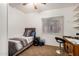 Bedroom with carpet, a ceiling fan, a window for natural light, and a dark furniture set at 1569 E Princeton Ave, Gilbert, AZ 85234