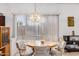 Cozy dining area with chandelier, round table, and seating for four at 1569 E Princeton Ave, Gilbert, AZ 85234