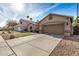 Charming single-Gathering home featuring a two-car garage and a well-maintained lawn with desert landscaping at 1569 E Princeton Ave, Gilbert, AZ 85234