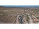 Expansive aerial view of a community nestled against a mountain, showcasing city views at 1614 E Kathleen Rd, Phoenix, AZ 85022
