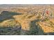 Wide aerial view of a sprawling residential area blending with the desert landscape at 1614 E Kathleen Rd, Phoenix, AZ 85022