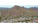 Scenic aerial view of a residential area nestled against a majestic mountain backdrop at 1614 E Kathleen Rd, Phoenix, AZ 85022