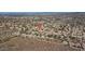 An aerial view of a community with mountain views from select lots, shown under blue skies in the distance at 1614 E Kathleen Rd, Phoenix, AZ 85022