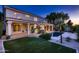 Beautiful backyard featuring a pool, covered patio, and lush landscaping, perfect for outdoor entertaining at 1614 E Kathleen Rd, Phoenix, AZ 85022