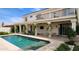 Wonderful backyard pool with a covered patio, outdoor TV, and second-floor balcony at 1614 E Kathleen Rd, Phoenix, AZ 85022