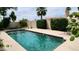 Relaxing backyard pool with neatly trimmed hedges and a refreshing atmosphere at 1614 E Kathleen Rd, Phoenix, AZ 85022