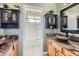 Bathroom with double sinks, granite countertops, and a walk-in shower at 1614 E Kathleen Rd, Phoenix, AZ 85022
