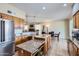 Open kitchen with granite countertops, stainless steel appliances, and a central island at 1614 E Kathleen Rd, Phoenix, AZ 85022