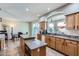 Bright kitchen featuring granite counters, a window above the sink and view to the dining area at 1614 E Kathleen Rd, Phoenix, AZ 85022