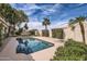 Sparkling pool surrounded by lush landscaping in a private backyard oasis at 1614 E Kathleen Rd, Phoenix, AZ 85022