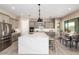 Bright kitchen with stainless steel appliances, large island, and adjacent dining area at 1620 E Cloud Rd, Phoenix, AZ 85086