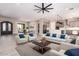 An elegant living room with modern furniture, an open layout, and easy access to the kitchen at 1620 E Cloud Rd, Phoenix, AZ 85086