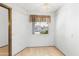 A simple dining room features a bright window to the exterior at 16827 N 103Rd Ave, Sun City, AZ 85351