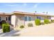 Exterior of a single-story home with brick accents, well-maintained landscaping, and a desert-friendly yard at 16827 N 103Rd Ave, Sun City, AZ 85351