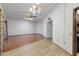 A large living space has both laminate and linoleum flooring and two fans at 16827 N 103Rd Ave, Sun City, AZ 85351