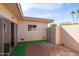 Private courtyard patio features brick pavers, privacy wall, and access to interior via sliding glass door at 16827 N 103Rd Ave, Sun City, AZ 85351