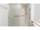 Accessible shower with grab bars and sliding glass door at 16827 N 103Rd Ave, Sun City, AZ 85351