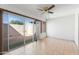 Bright sunroom with tile flooring and sliding glass doors to patio at 16827 N 103Rd Ave, Sun City, AZ 85351