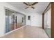 Bright sun room featuring tile floor, ceiling fan and sliding glass door for access to exterior at 16827 N 103Rd Ave, Sun City, AZ 85351