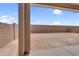 Large backyard with a covered patio and block wall at 17033 W Royal Palm Rd, Waddell, AZ 85355