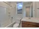 Bathroom with tub and shower combo, white countertops, and natural wood vanity at 17033 W Royal Palm Rd, Waddell, AZ 85355