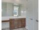 Spacious bathroom with quartz countertops, dual sinks, large mirror, and modern fixtures at 17033 W Royal Palm Rd, Waddell, AZ 85355