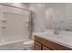 Well-lit bathroom featuring a vanity, sink, toilet and shower with tub at 17033 W Royal Palm Rd, Waddell, AZ 85355