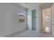 Cozy bedroom featuring a window and a closet with sliding doors to maximize space at 17033 W Royal Palm Rd, Waddell, AZ 85355