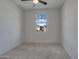 Bright bedroom with neutral carpet, and a window with neighborhood views at 17033 W Royal Palm Rd, Waddell, AZ 85355