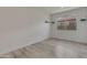 Bright bedroom featuring a window and shelves to maximize space and comfort at 17033 W Royal Palm Rd, Waddell, AZ 85355