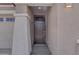 Close up view of the house's front door, a dark color, and a small porch at 17033 W Royal Palm Rd, Waddell, AZ 85355