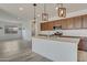 Open kitchen featuring stainless steel appliances, quartz countertops, and recessed lighting at 17033 W Royal Palm Rd, Waddell, AZ 85355