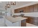 Close up kitchen view featuring the island with stainless steel appliances and range at 17033 W Royal Palm Rd, Waddell, AZ 85355
