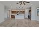 Bright kitchen showcasing a large center island, stainless appliances, and wood cabinetry at 17033 W Royal Palm Rd, Waddell, AZ 85355