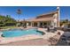 Resort-style backyard with a pool, outdoor grill and dining area, and a covered patio, perfect for entertaining at 17246 N 56Th Way, Scottsdale, AZ 85254