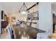 Elegant dining room with dark wood table, chandelier, and views into living room, perfect for gatherings at 17246 N 56Th Way, Scottsdale, AZ 85254