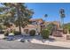 Well-maintained home with mature trees, desert landscaping, and a tile roof, offering a serene and inviting curb appeal at 17246 N 56Th Way, Scottsdale, AZ 85254