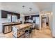 Well-equipped kitchen featuring stainless steel appliances, granite countertops, tiled floors, and an island with bar seating at 17246 N 56Th Way, Scottsdale, AZ 85254