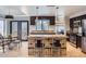 Bright eat-in kitchen with stainless appliances, granite countertops, an island with bar seating and access to the backyard at 17246 N 56Th Way, Scottsdale, AZ 85254