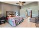 Spacious main bedroom featuring a ceiling fan, high ceilings and access to an ensuite bathroom at 17246 N 56Th Way, Scottsdale, AZ 85254