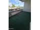 Large private balcony overlooking the building exterior and features patterned accents at 17404 N 99Th Ave # 214, Sun City, AZ 85373