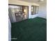 Spacious balcony with a carpeted floor and views into an interior room at 17404 N 99Th Ave # 214, Sun City, AZ 85373