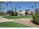Beautifully landscaped community with lush green spaces and mature trees at 17404 N 99Th Ave # 214, Sun City, AZ 85373