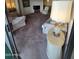 Living room showcasing neutral carpeting and a view to the outside at 17404 N 99Th Ave # 214, Sun City, AZ 85373