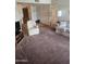 Living room showcasing neutral carpeting and ample space for seating at 17404 N 99Th Ave # 214, Sun City, AZ 85373